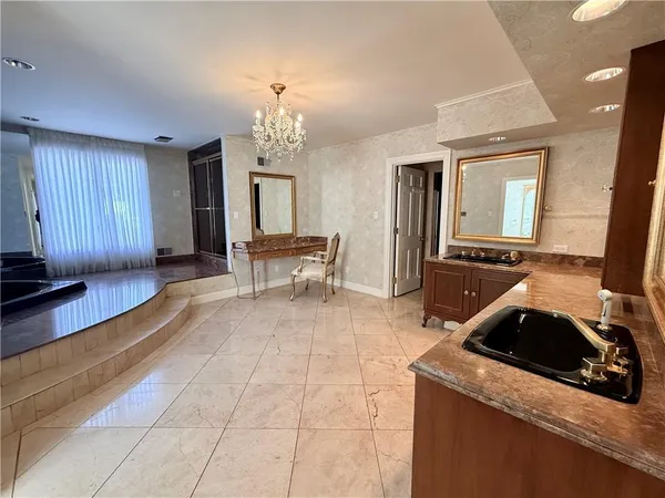 a kitchen that has a sink and a stove in it