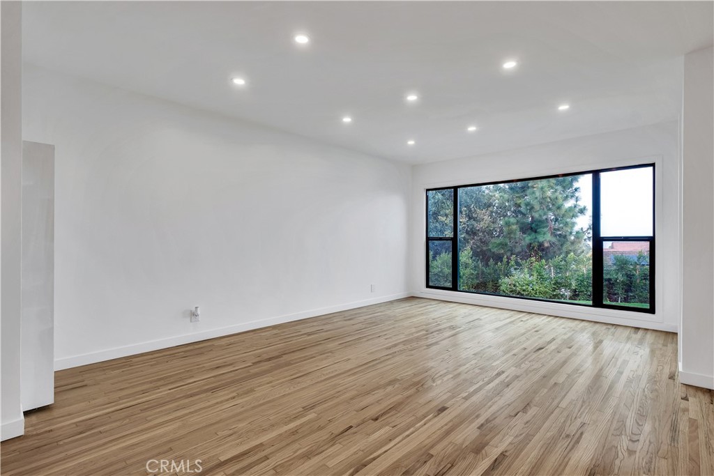 25710 Crest Road Torrance, CA 90505 - Photo 20 of 72 Large window fills the space with natural light, enhancing the airy and welcoming atmosphere.