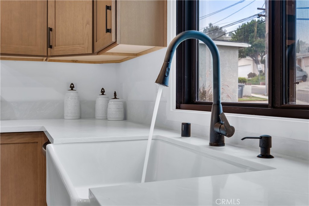 25710 Crest Road Torrance, CA 90505 - Photo 27 of 70 The kitchen includes a sleek pull-down faucet with a high-arc design and flexible spray head, offering both style and convenience for everyday use.