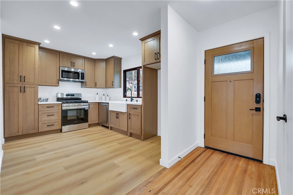 25710 Crest Road Torrance, CA 90505 - Photo 28 of 70 Your Kitchen has new luxury laminated flooring, new recessed lighting that flow perfectly with your new high-end Signet Fiberglass entry door.