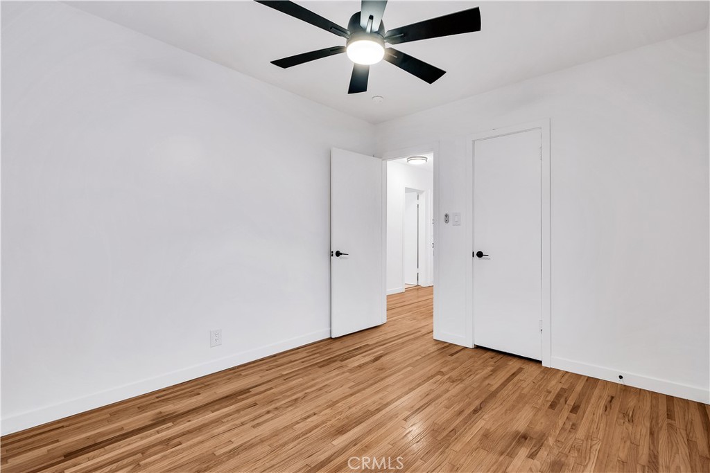 25710 Crest Road Torrance, CA 90505 - Photo 38 of 72 Front Bedroom #3 with beautiful refinished original hardwood floors, new baseboards & new ceiling fan.