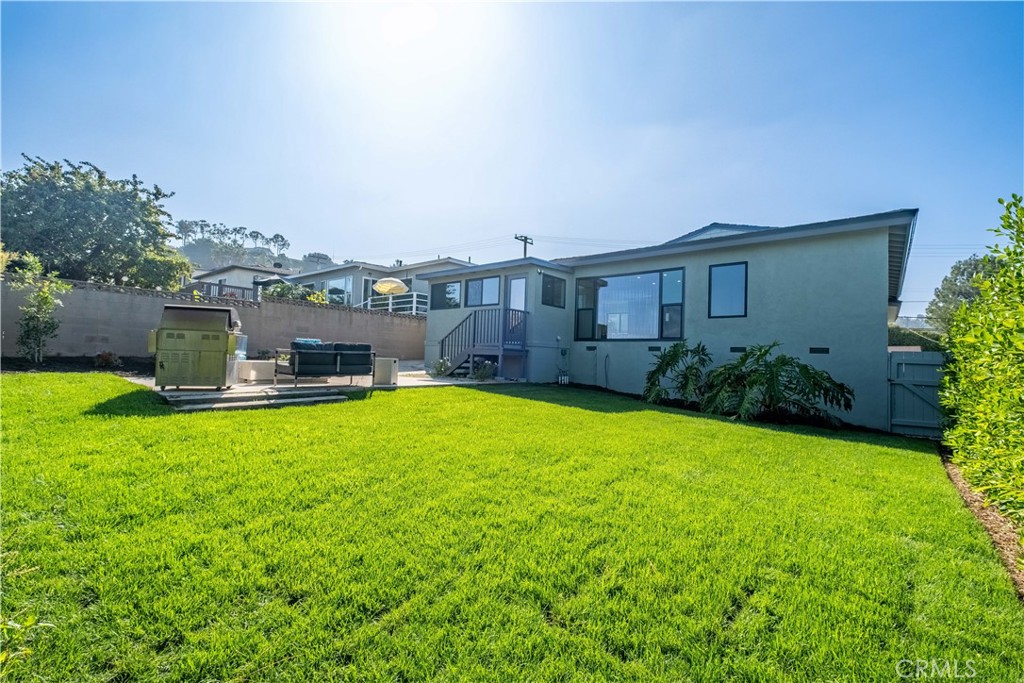 25710 Crest Road Torrance, CA 90505 - Photo 58 of 72 Back view of your property featuring the new landscape yard & the outdoor living space.