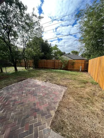 a view of a backyard with trees