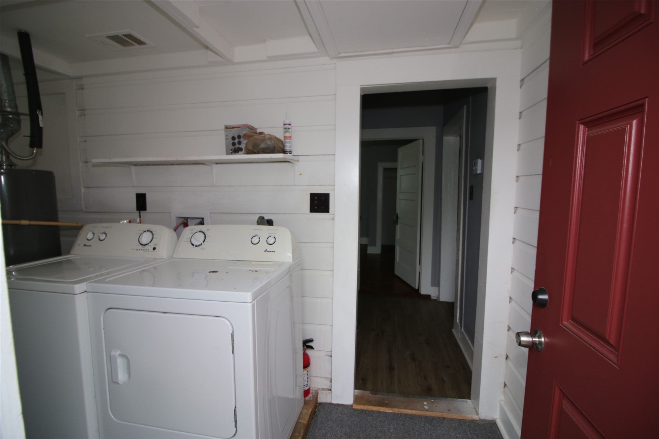 418 3rd Street Humble, TX 77338 - Photo 15 of 20 This cozy laundry room combines functionality and convenience to streamline your daily chores.