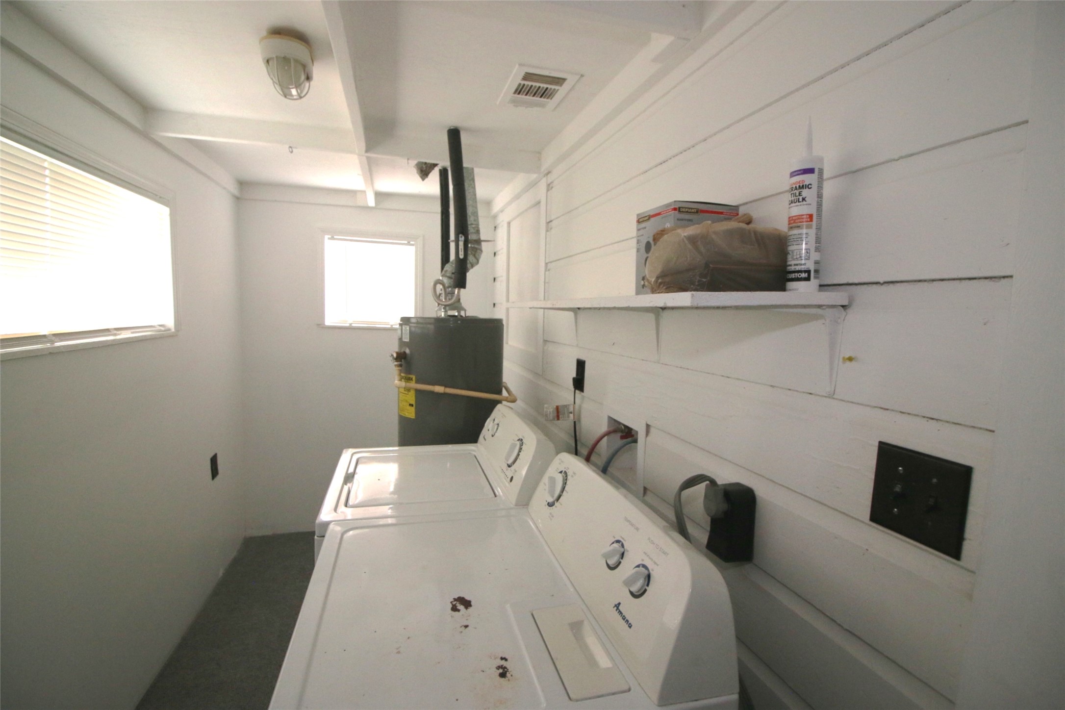 418 3rd Street Humble, TX 77338 - Photo 16 of 20 Effortlessly tackle laundry day in this bright, functional space, featuring ample natural light and convenient shelving for all your essentials.