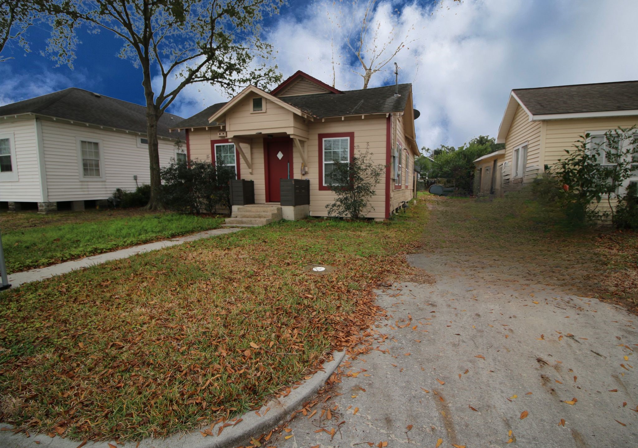 418 3rd Street Humble, TX 77338 - Photo 2 of 20 This charming single-story home features a cozy front porch, a nice size lawn, and a single driveway. It's nestled between similar houses in a quiet neighborhood, offering a quaint and inviting atmosphere.