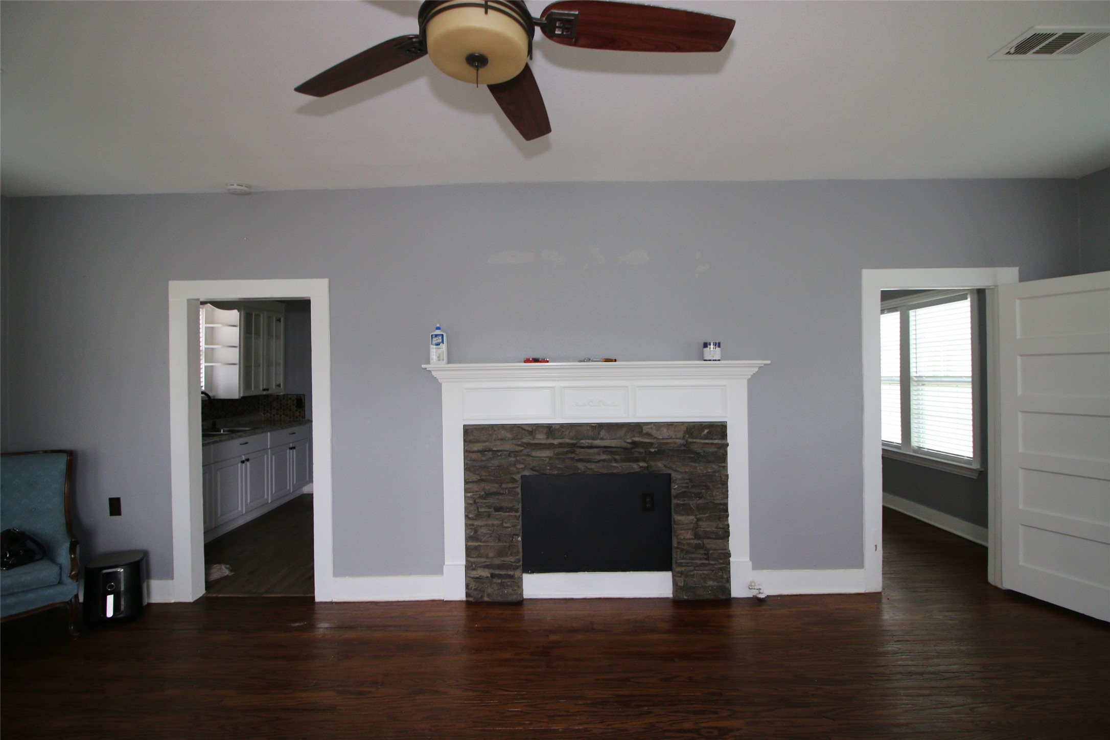 418 3rd Street Humble, TX 77338 - Photo 3 of 20 Discover a cozy living space featuring a faux fireplace that adds charm and style without the hassle.