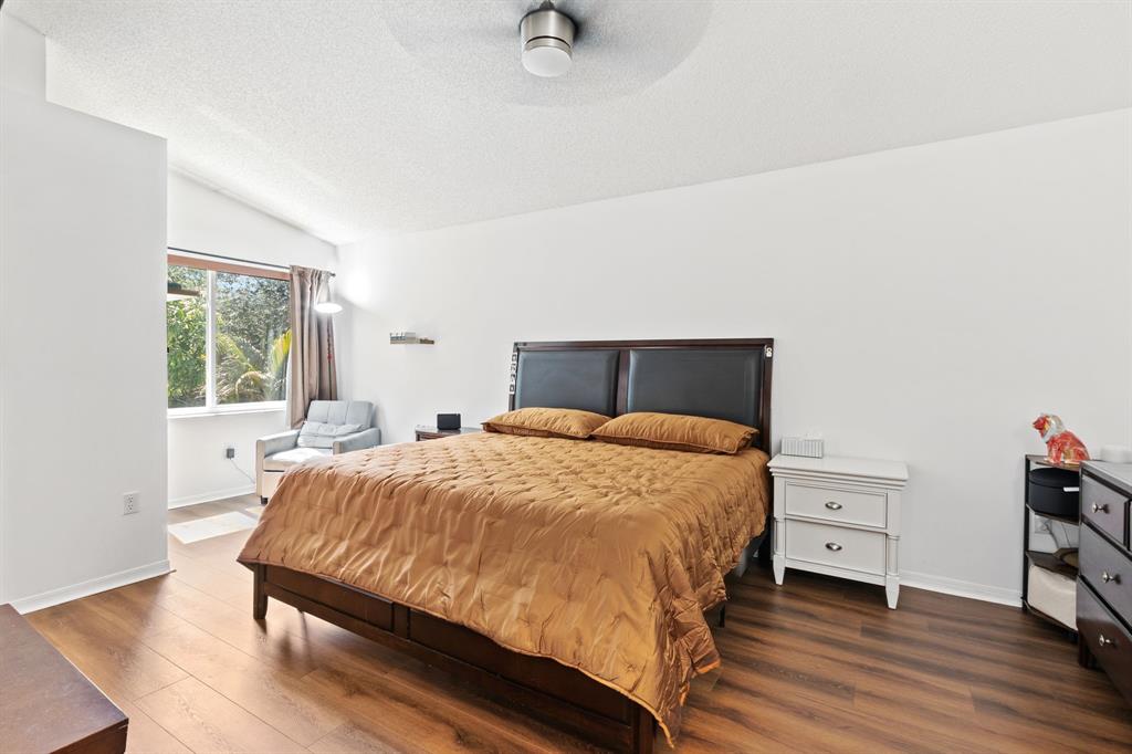 4035 Tree Top Road Cooper City, FL 33026 - Photo 15 of 33 a bedroom with a bed and window