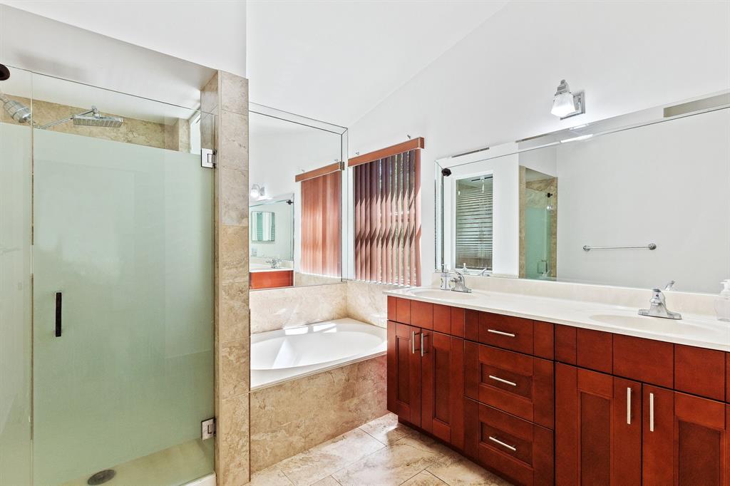 4035 Tree Top Road Cooper City, FL 33026 - Photo 17 of 33 a bathroom with a tub sink shower and mirror