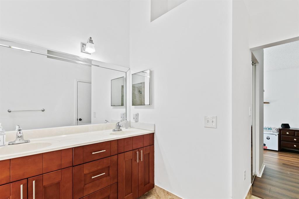 4035 Tree Top Road Cooper City, FL 33026 - Photo 20 of 33 a bathroom with a double vanity sink and a mirror
