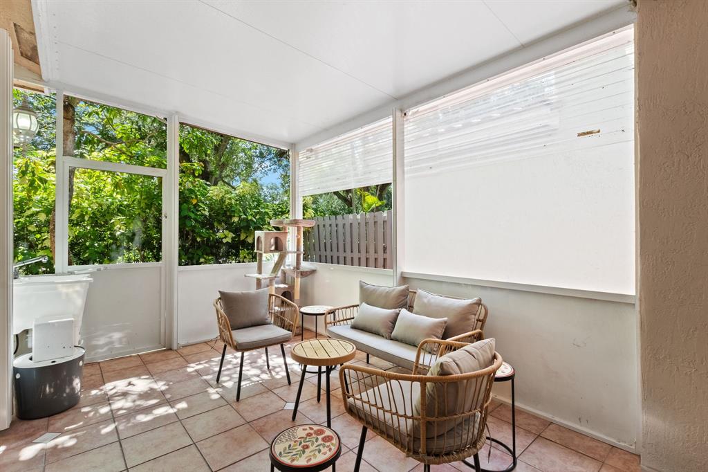 4035 Tree Top Road Cooper City, FL 33026 - Photo 25 of 33 a living room with furniture and a window