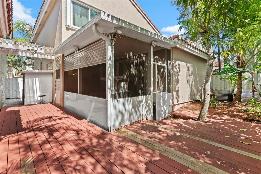 4035 Tree Top Road Cooper City, FL 33026 - Photo 26 of 33 a view of a house with a porch