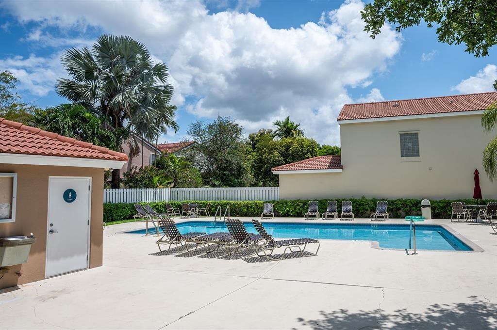4035 Tree Top Road Cooper City, FL 33026 - Photo 32 of 33 a view of backyard with swimming pool and furniture