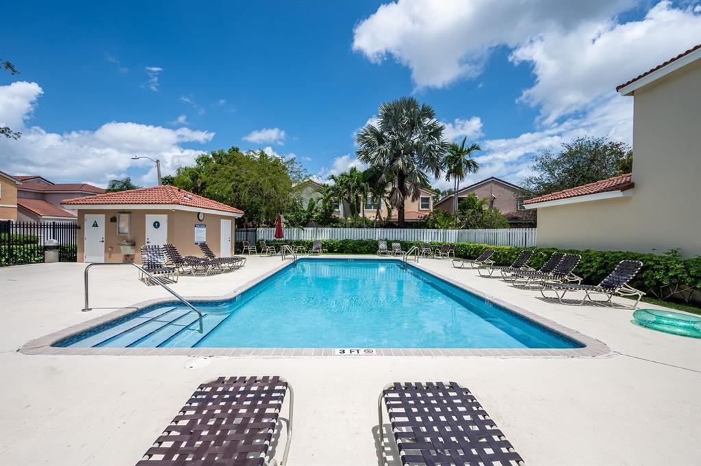 4035 Tree Top Road Cooper City, FL 33026 - Photo 33 of 33 a view of swimming pool with outdoor seating