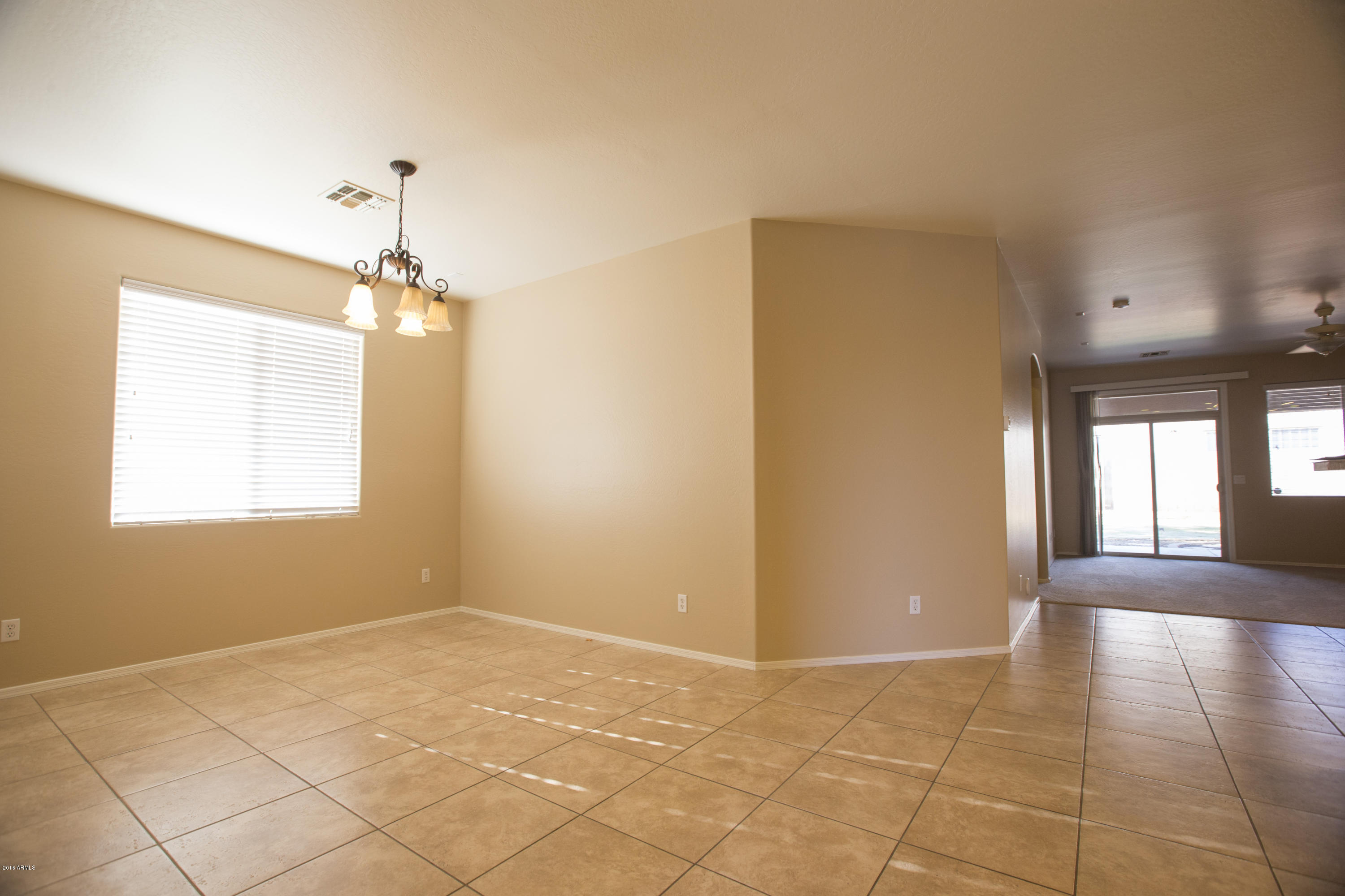6821 West Carson Road Laveen, AZ 85339 - Photo 8 of 41 dining room into livingroom