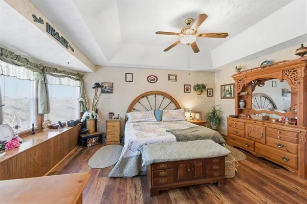 a living room with lots of furniture and a chandelier