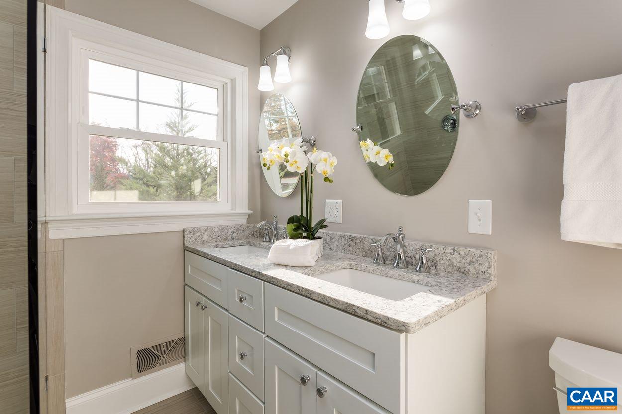 111 Westminster Road Charlottesville, VA 22901 - Photo 29 of 39 a bathroom with a double vanity sink and a mirror