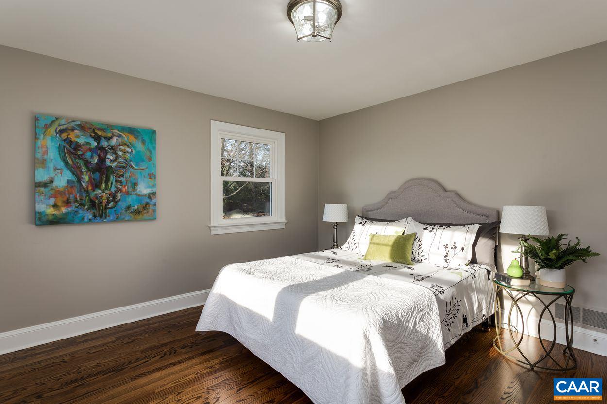 111 Westminster Road Charlottesville, VA 22901 - Photo 33 of 39 a bedroom with a bed and wooden floor