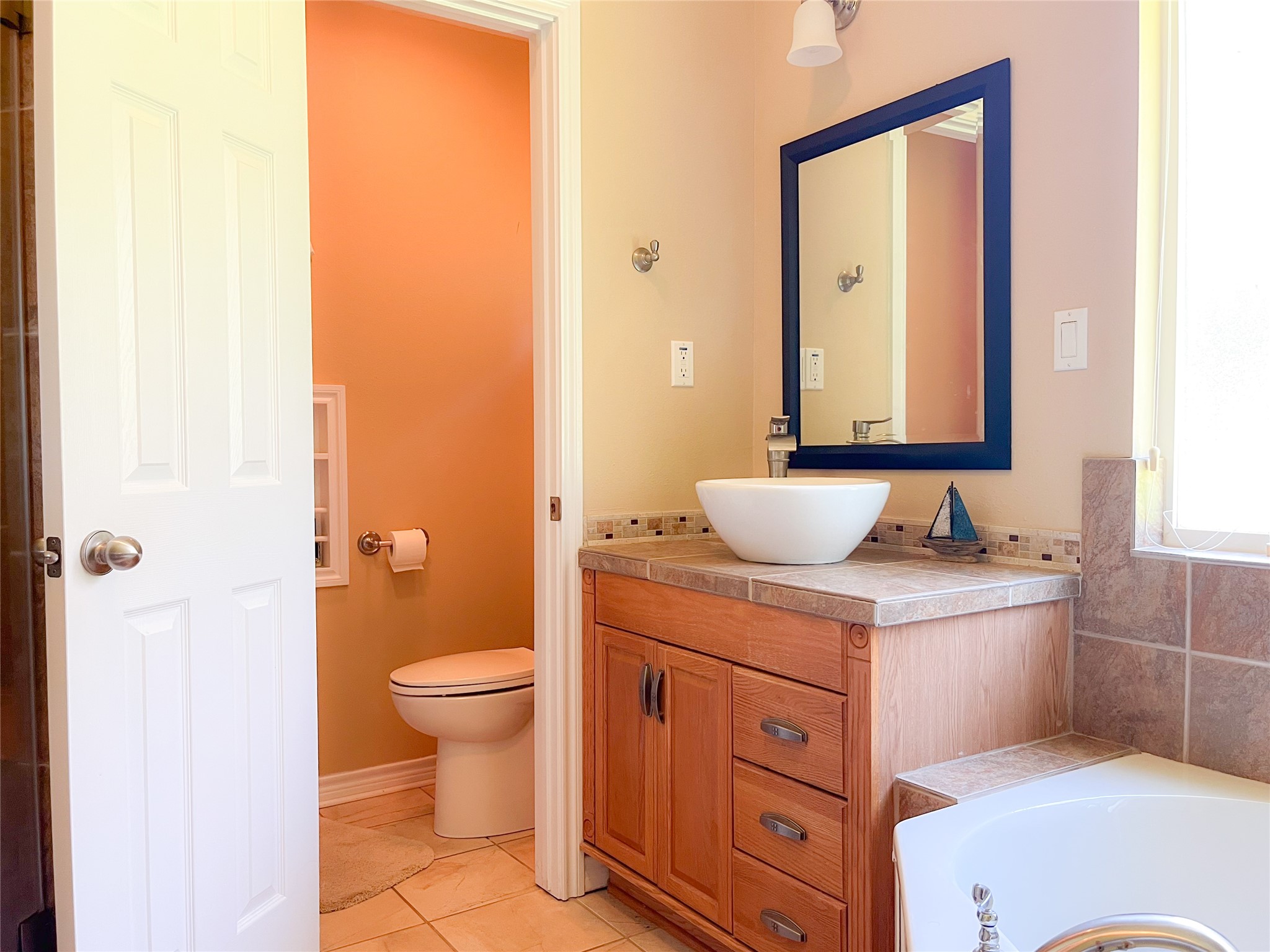 231 Memphis Belle Trinity, TX 75862 - Photo 42 of 47 a bathroom with a sink a toilet and mirror