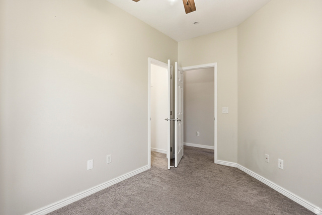 1177 Northfield Road, Unit 26 Cedar City, UT 84721 - Photo 29 of 45 Carpeted room with vaulted ceilings and a ceiling fan