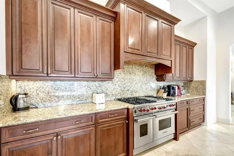 a bed room with furniture and a flat screen tv
