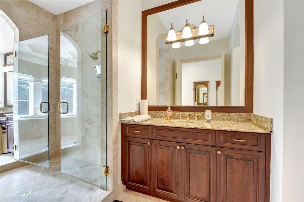 6453 Montesito Street Boca Raton, FL 33496 - Photo 35 of 60 a bathroom with a granite countertop sink a mirror and a shower