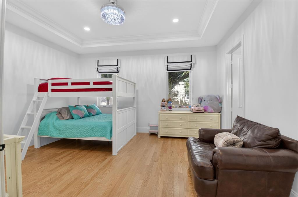 6453 Montesito Street Boca Raton, FL 33496 - Photo 39 of 60 a room with furniture and a wooden floor