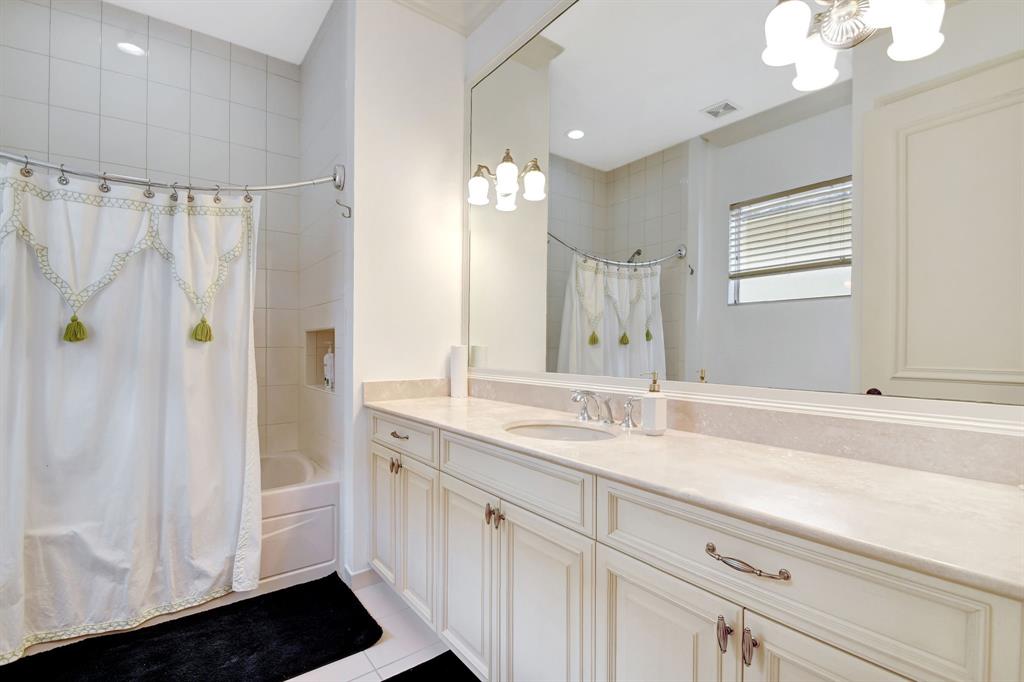 6453 Montesito Street Boca Raton, FL 33496 - Photo 40 of 60 a bathroom with a sink and a mirror