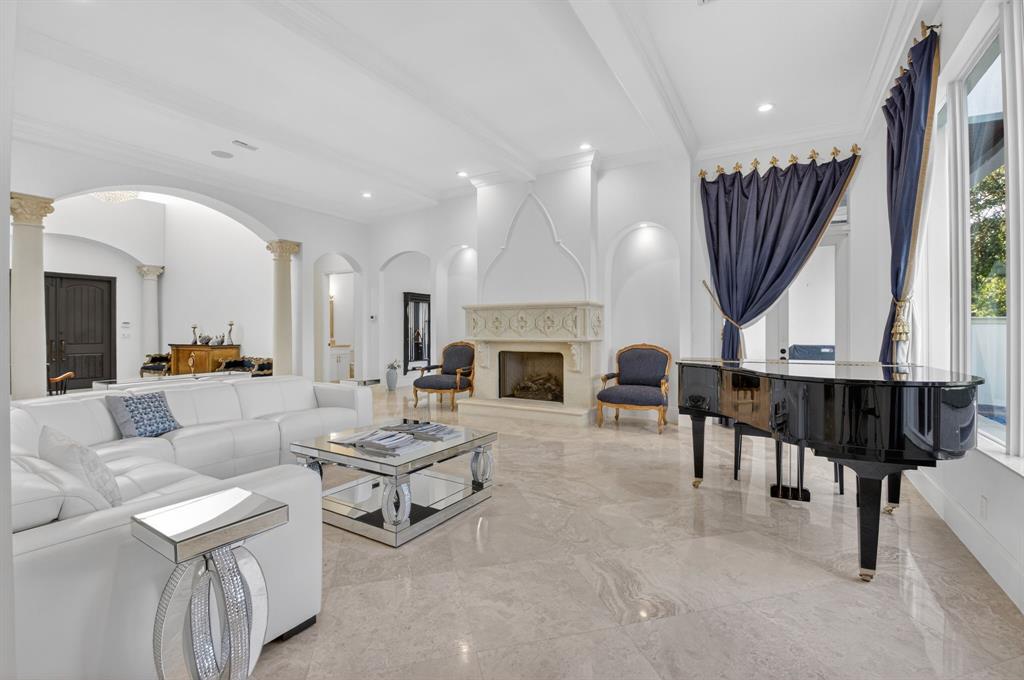 6453 Montesito Street Boca Raton, FL 33496 - Photo 5 of 60 a living room with furniture fireplace and a large window