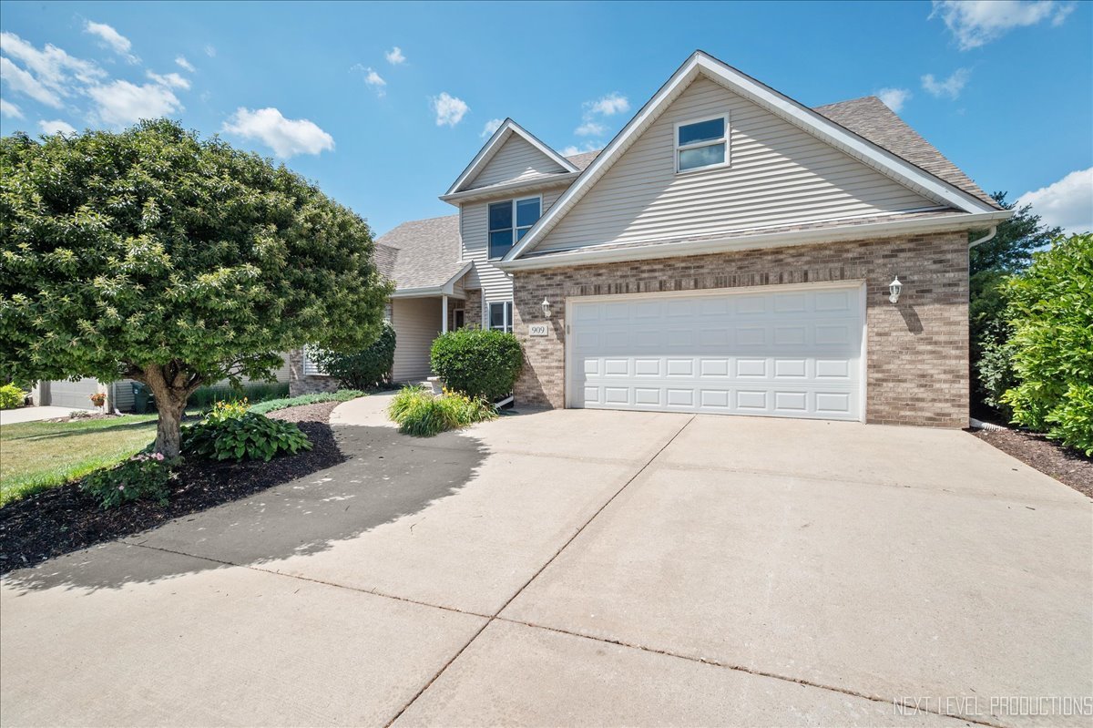 909 Casey Drive Minooka, IL 60447 - Photo 1 of 1 a front view of a house with a yard and a garage