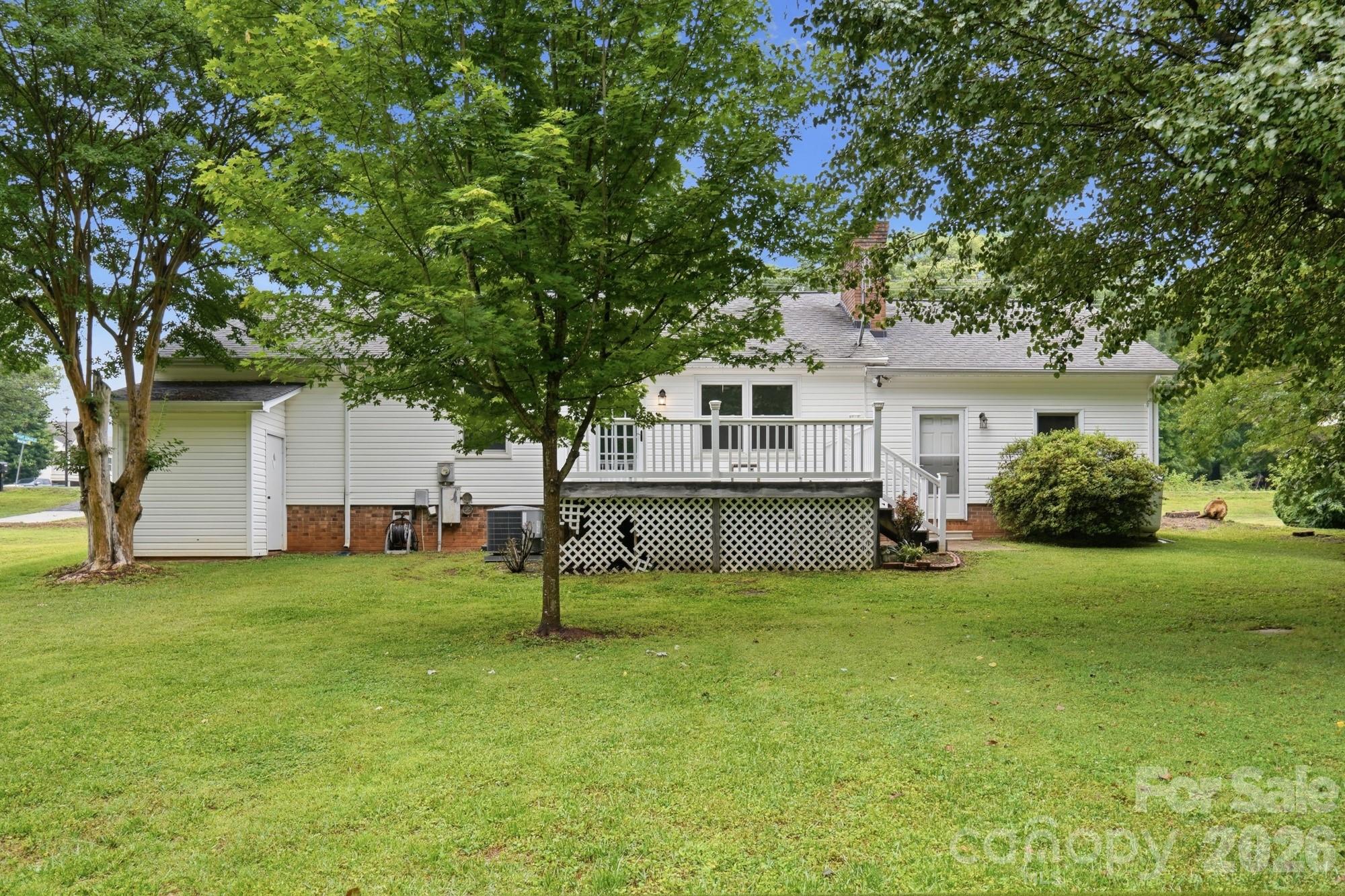 1235 Winecoff School Road Concord, NC 28027 - Photo 24 of 27 a view of a house with a backyard