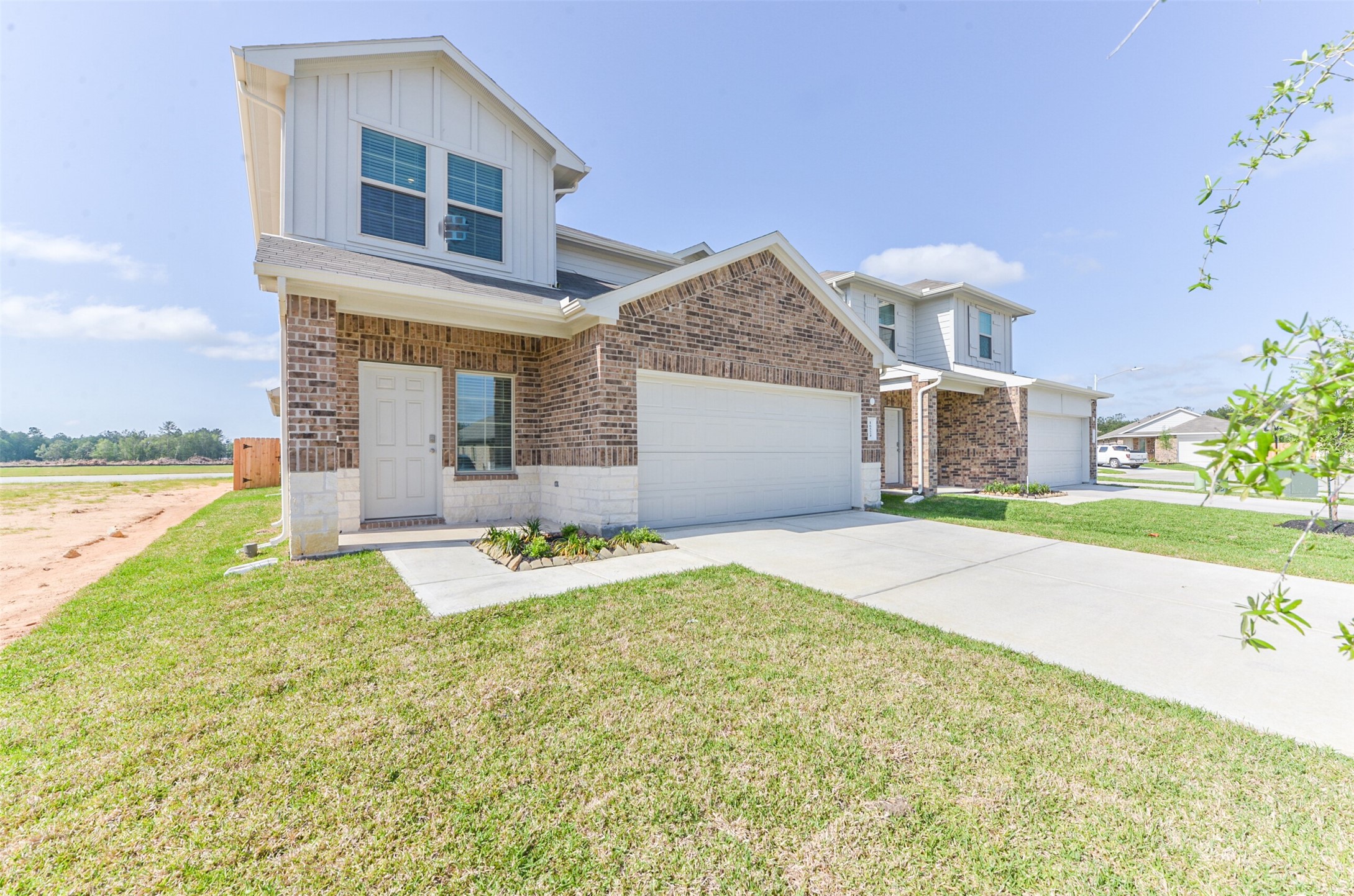 16524 Cascading Pnes Court Conroe, TX 77302 - Photo 1 of 34 2 story with stuning lake view in the back and green space on the left for added privacy!!