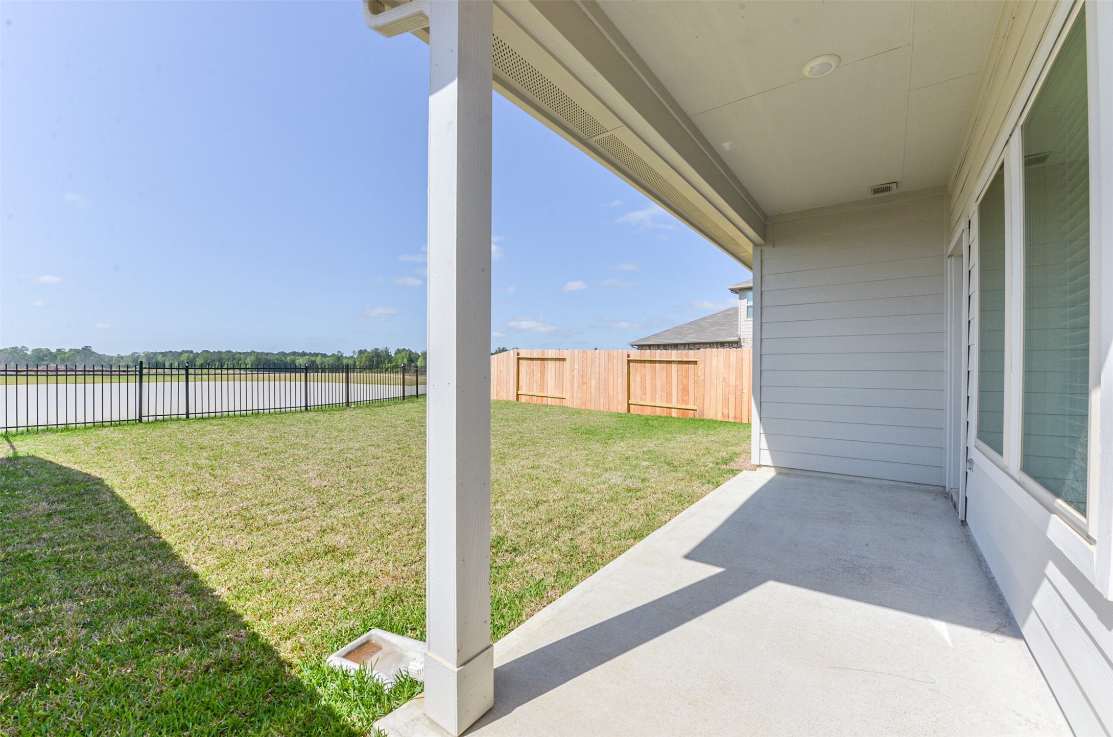 16524 Cascading Pnes Court Conroe, TX 77302 - Photo 2 of 34 Sip your morning coffee on the patio while enjoying the stunning lake view!
