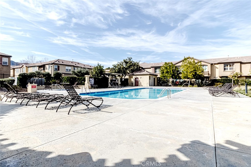 25562 Huxley Drive Stevenson Ranch, CA 91381 - Photo 19 of 24 a view of swimming pool with outdoor seating and a television
