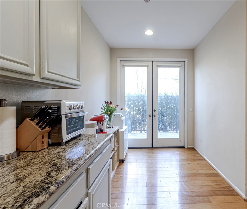 25562 Huxley Drive Stevenson Ranch, CA 91381 - Photo 6 of 24 a view of a kitchen with furniture and a window