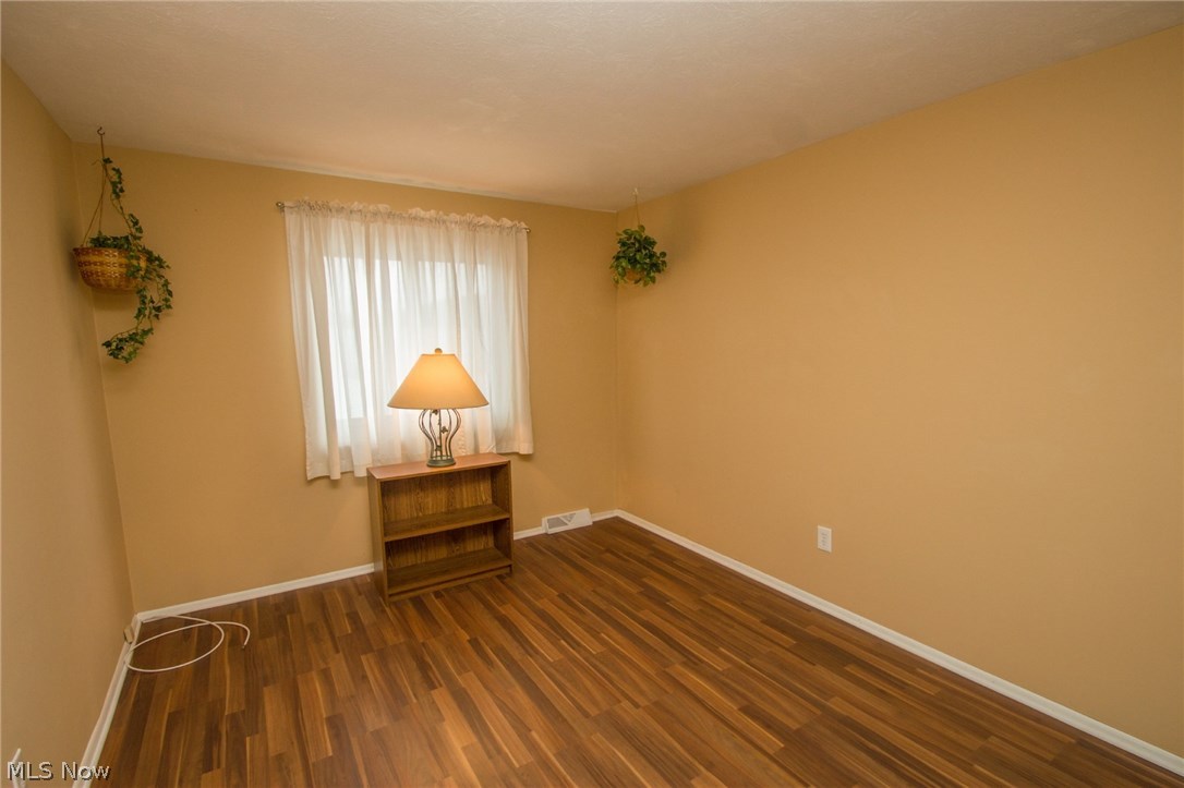 6480 State Road, Unit F17 Parma, OH 44134 - Photo 21 of 31 Bedroom 3 with wood look laminate floor