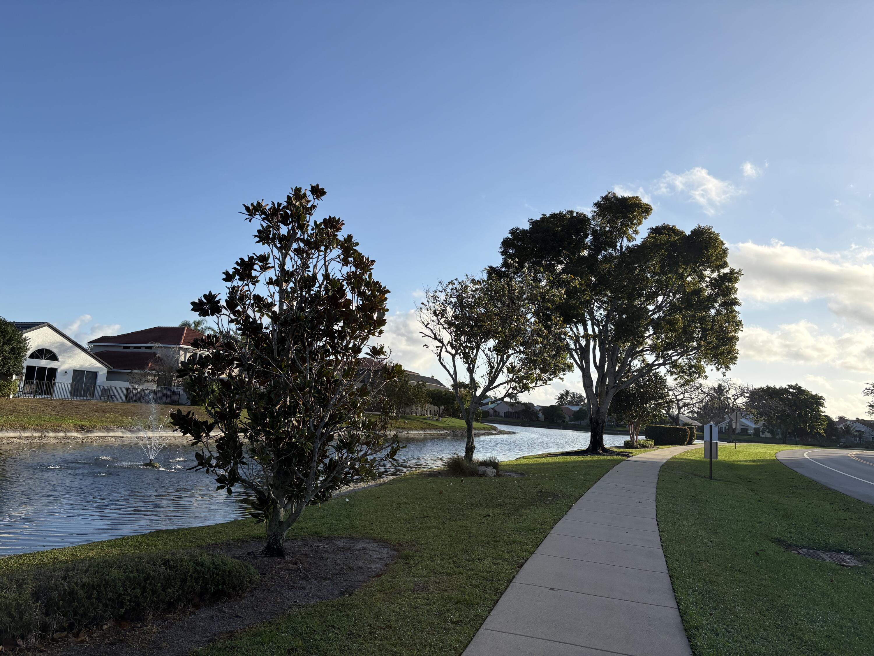 10889 Tamoron Lane Boca Raton, FL 33498 - Photo 23 of 33 10889 Tamoron - Lake-Sidewalk Pics