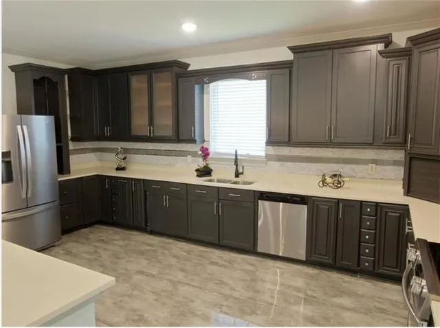 a view of a room with wooden floor and chandelier