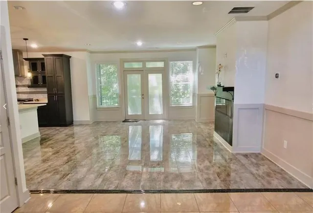 a view of walk in closet with wooden floor