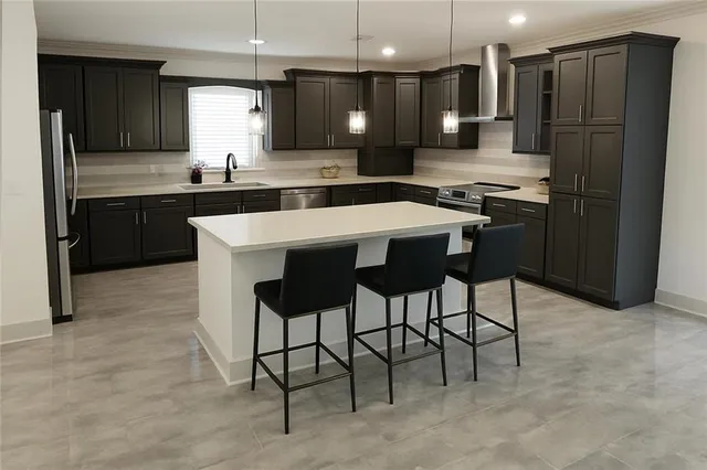 a view of a workspace with furniture and window