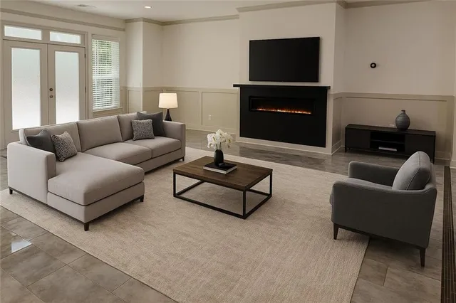 a view of a livingroom with workspace and a couch