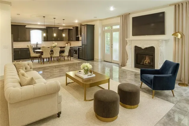 a view of an empty room with wooden floor and closet
