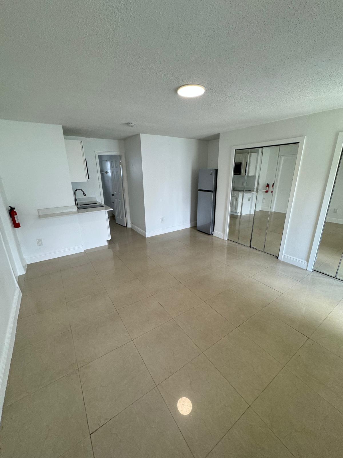 512 Southwest 2nd Street, Unit A Hallandale Beach, FL 33009 - Photo 4 of 13 a view of empty room