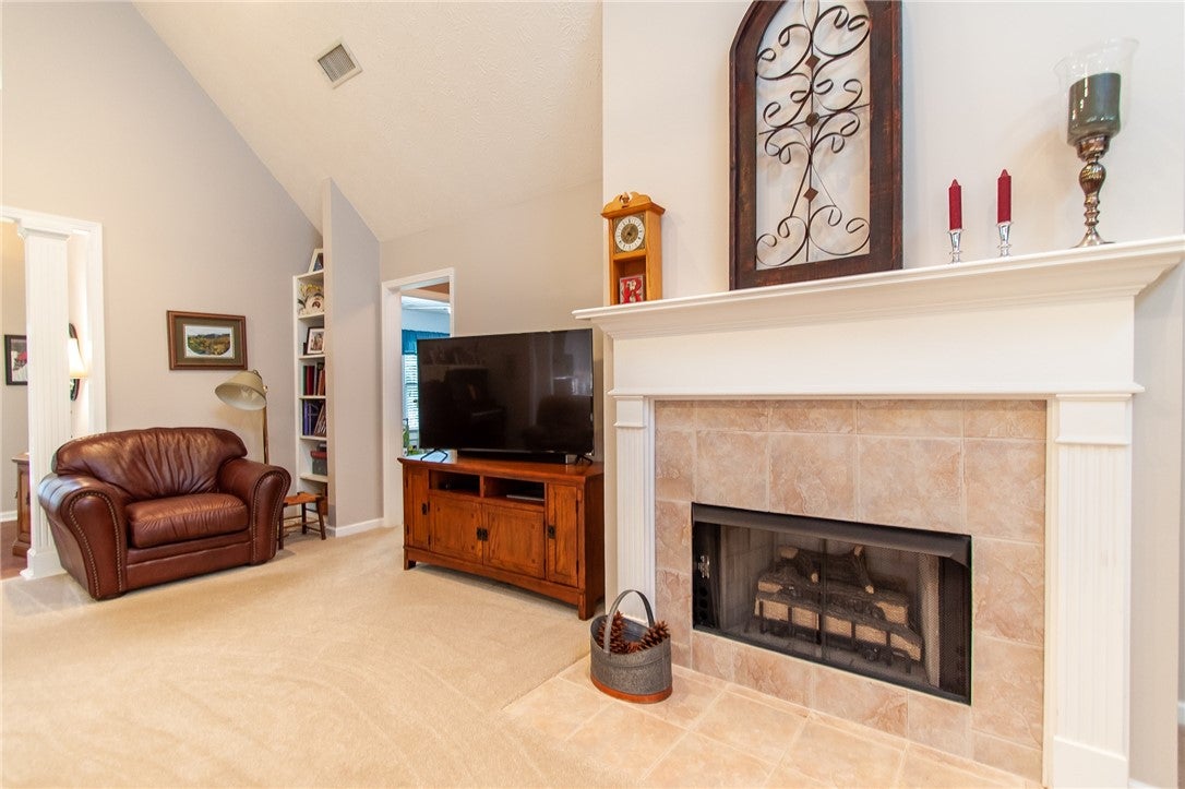 575 Deer Run Road Auburn, AL 36832 - Photo 10 of 42 Here is the fireplace with a flush hearth. Note the built-in bookcase beside the easy chair.