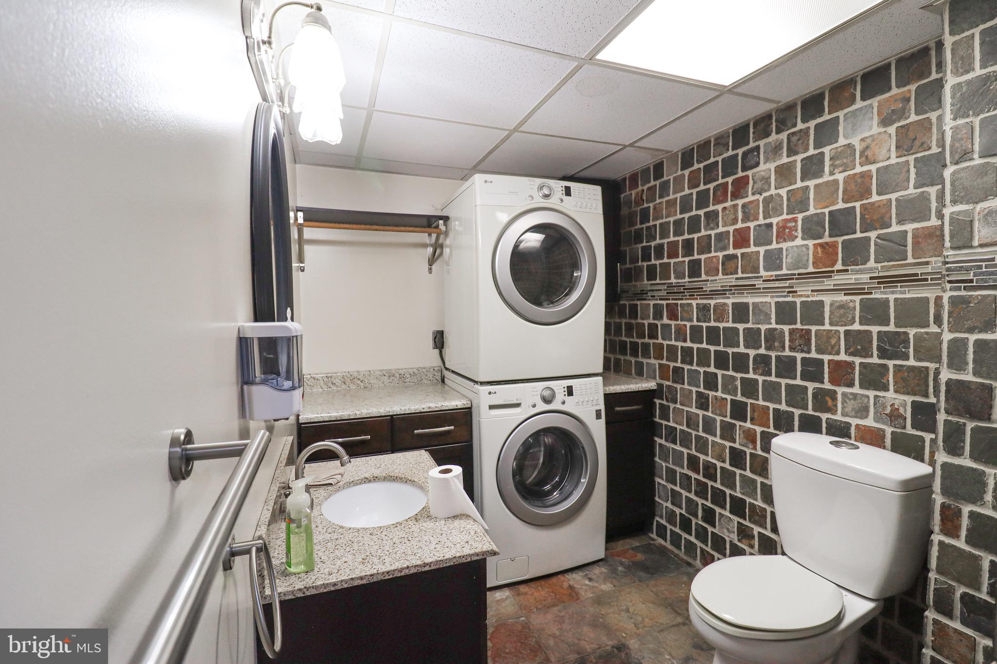 170 Donrene Road Mount Wolf, PA 17347 - Photo 18 of 71 a bathroom with a granite countertop toilet and a sink