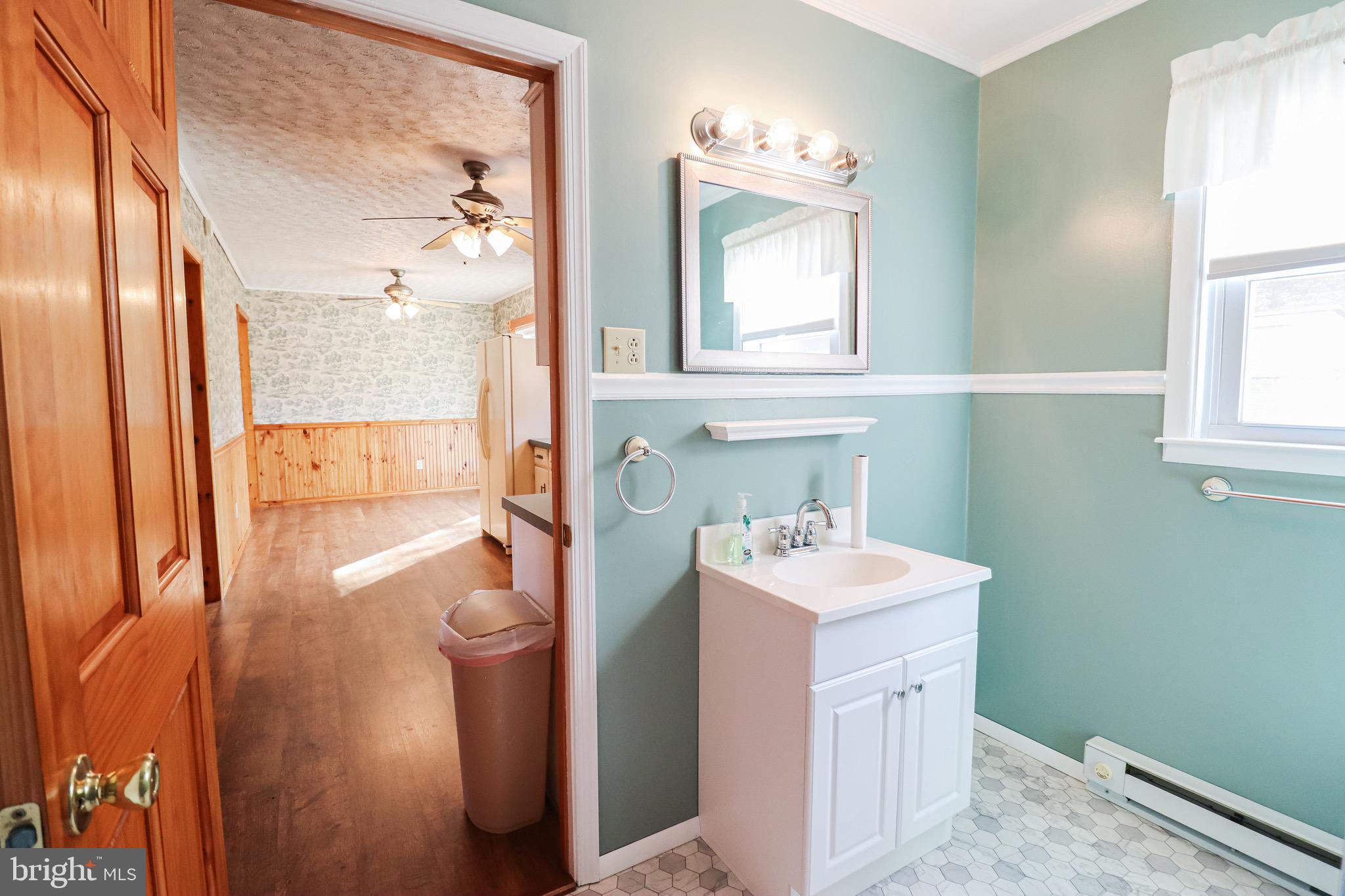 170 Donrene Road Mount Wolf, PA 17347 - Photo 29 of 71 a bathroom with a sink a toilet and a mirror