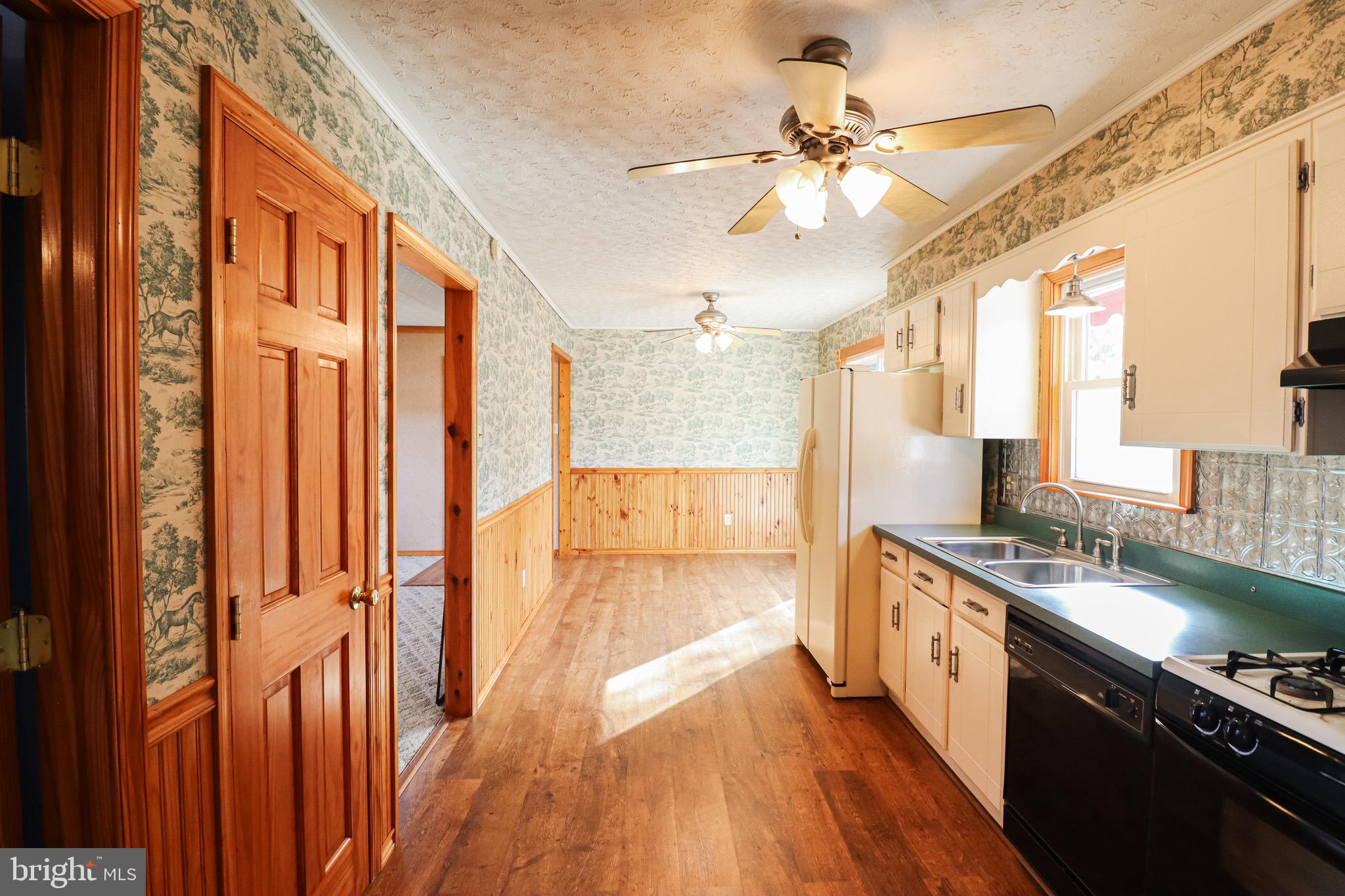 170 Donrene Road Mount Wolf, PA 17347 - Photo 32 of 71 a view of a kitchen with a sink and wooden floor