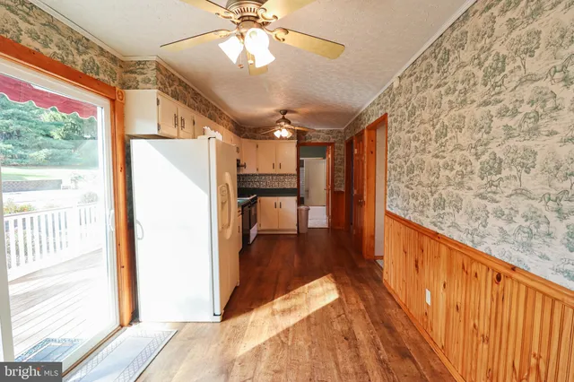 a kitchen with stainless steel appliances a stove a sink and a refrigerator