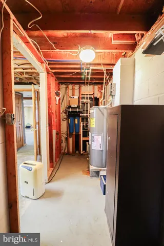 a view of a house with pool and a yard