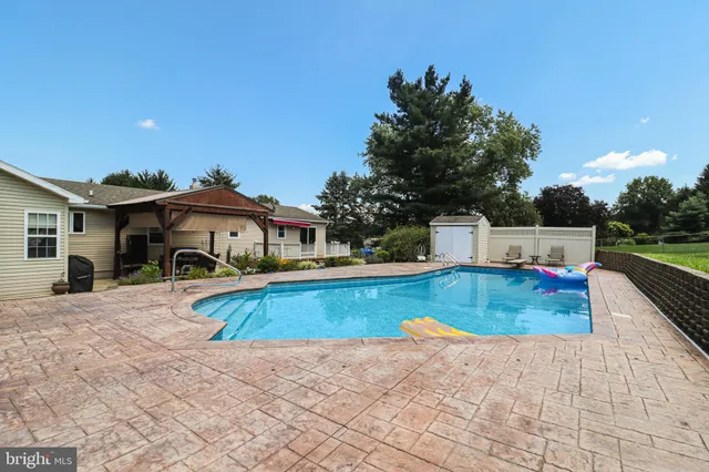 a view of swimming pool with a yard